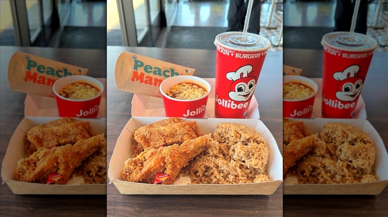 Variety of Jollibee dishes on paper tray at restaurant