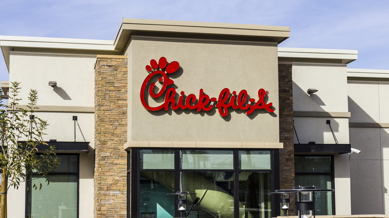Red Chick-fil-A sign on beige building