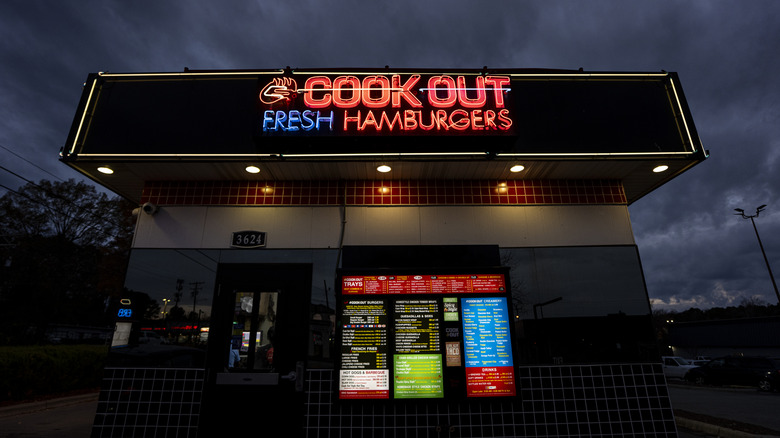 Cook Out restaurant at night with lit-up sign