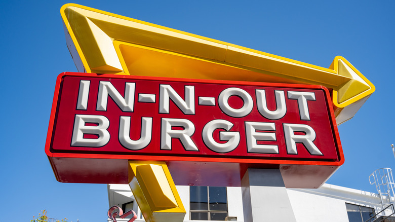 In-N-Out Burger sign against blue sky background