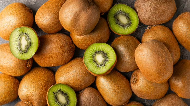 Whole and halved kiwis