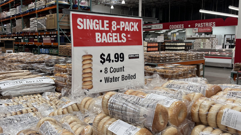 Costco bakery with a view of bagels and sign