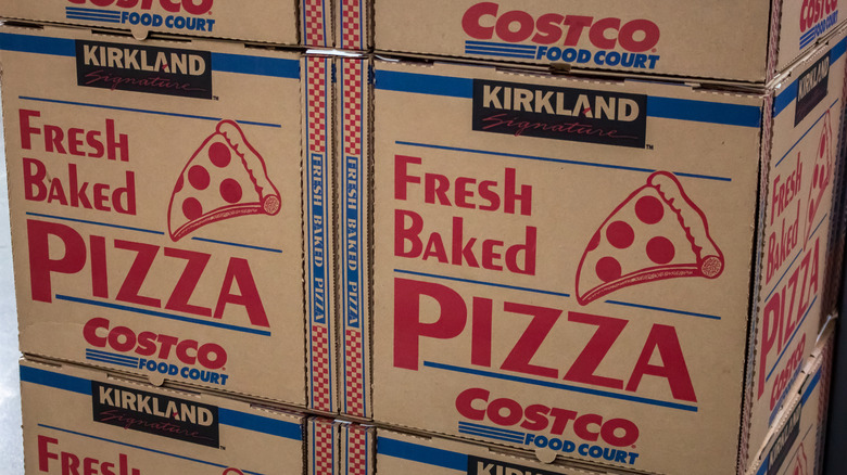 Costco pizza cardboard boxes stacked up