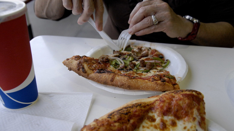 A slice of Costco combo pizza