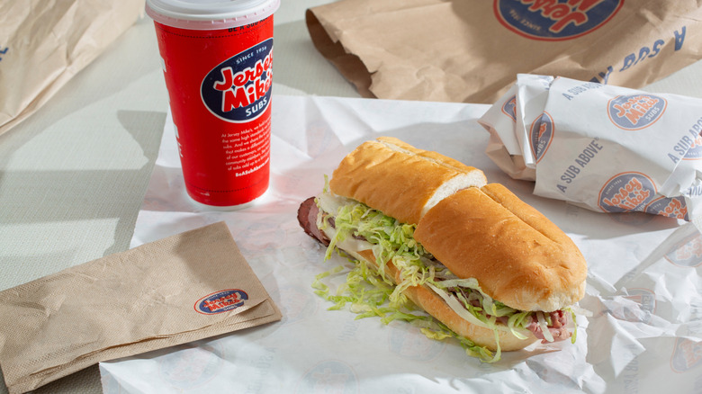 A Jersey Mike's combo meal with drink and sandwich on wrapping