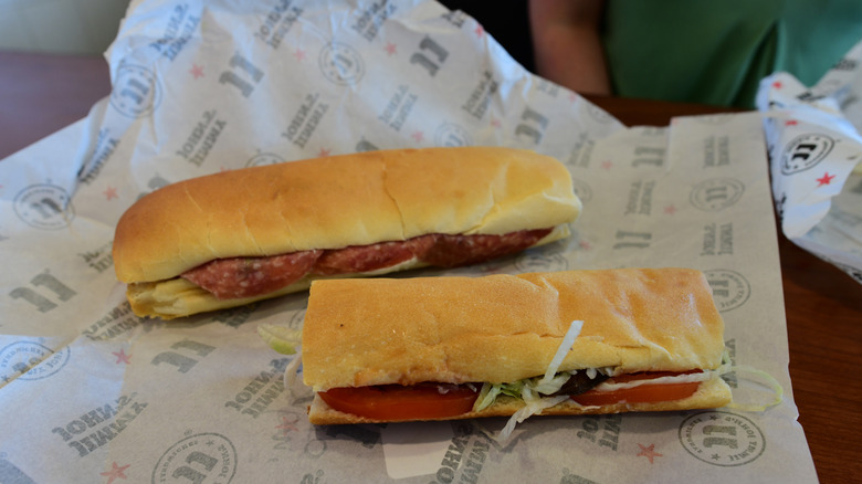 Two Jimmy John's sandwiches on open paper