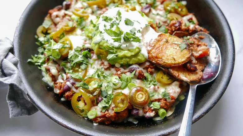 Bowl of Italian nachos with spoon