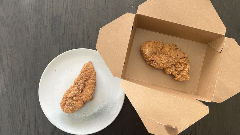 Whole Foods hot bar chicken strips on a plate.