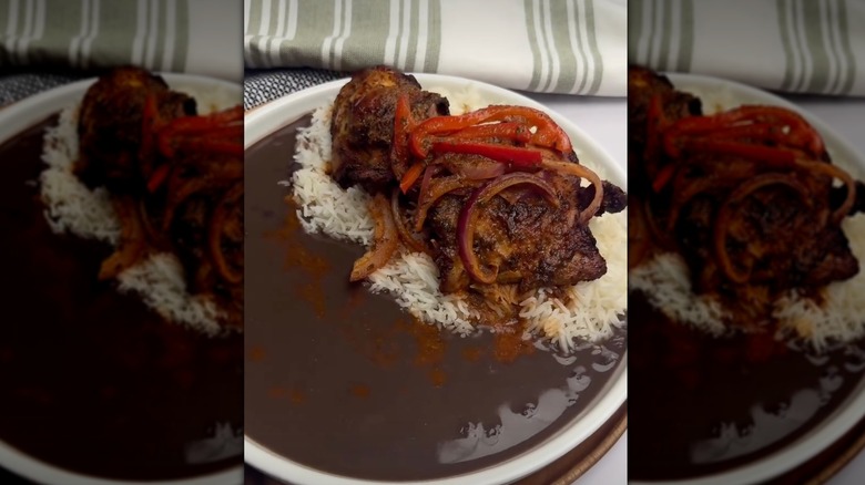 A black bean sauce with rice and chicken