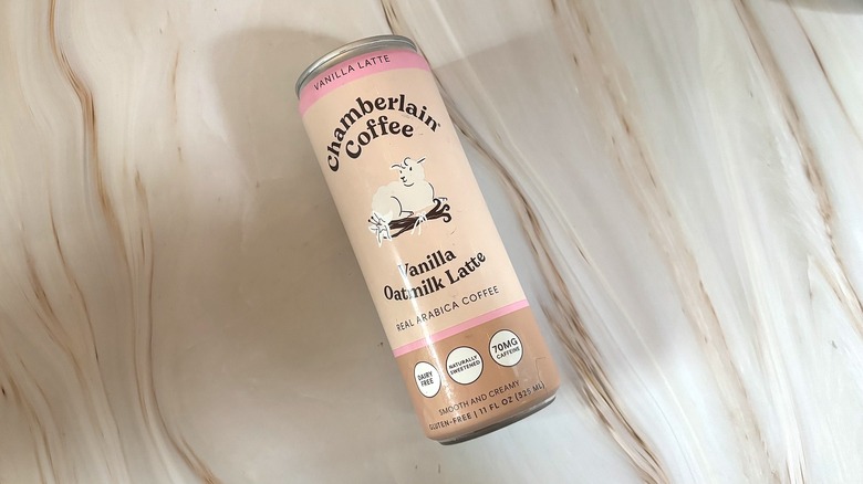 Can of Chamberlain Coffee Vanilla Oatmilk Latte on marbled surface