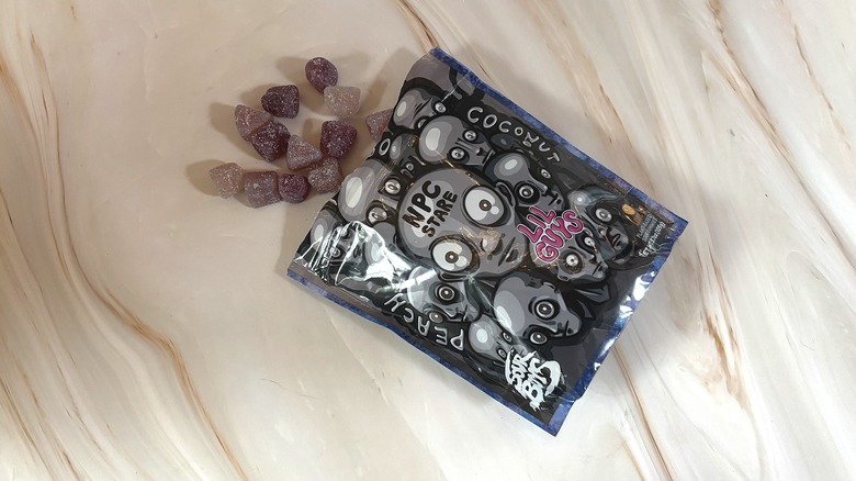 Sour Boys NPC Stare spilling out of package onto marbled surface