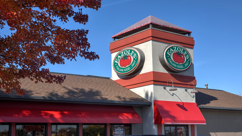 Outside of Fazoli's restaurant next to tree and blue sky