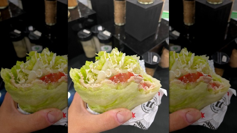 Hand holding half-eaten Jimmy John's Unwich