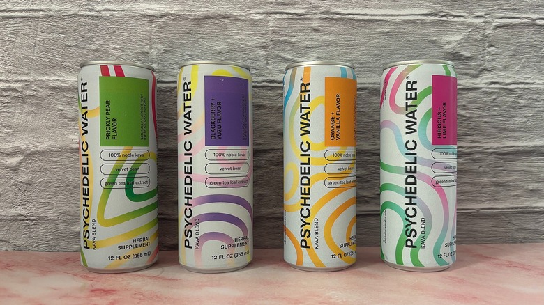Four Psychedelic Water cans on grey background