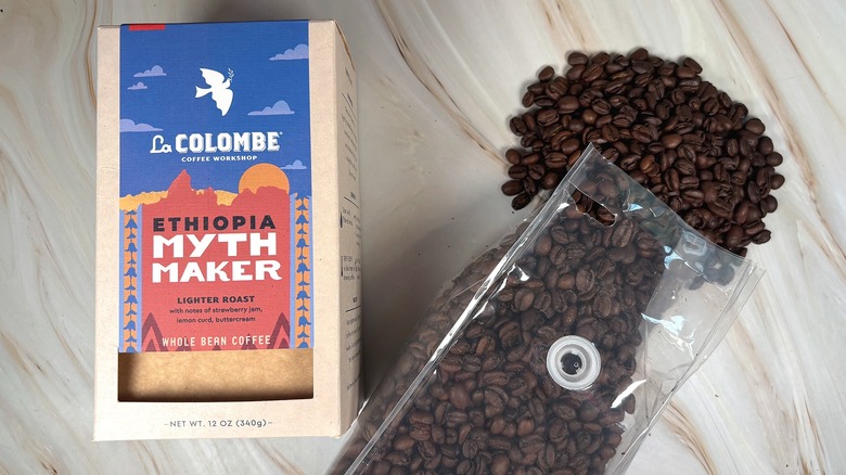 Box of La Colombe Ethiopia Myth Maker next to bag of beans spilling out onto table