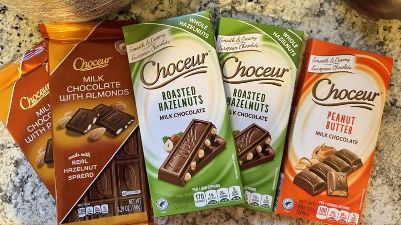 Different Aldi chocolate bars arranged on granite countertop