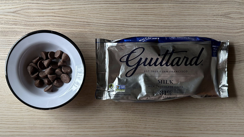 Guittard Milk Chocolate Chips on wooden table