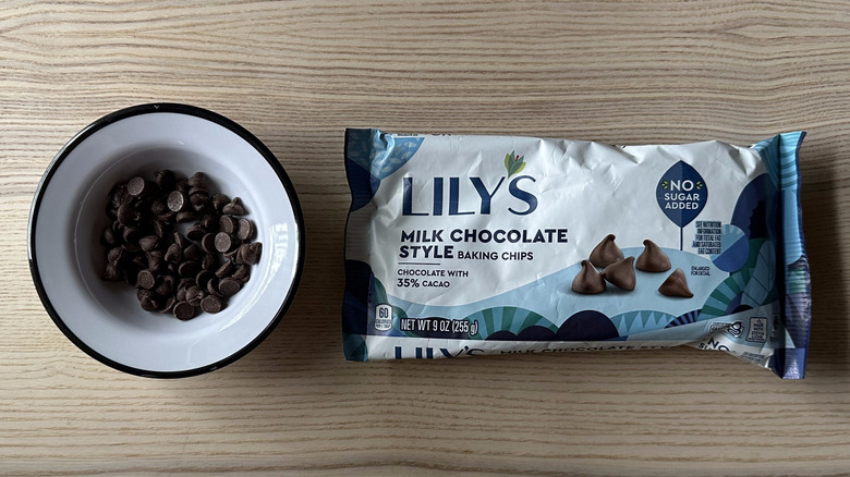 Lily's Milk Chocolate Style Baking Chips on wooden table