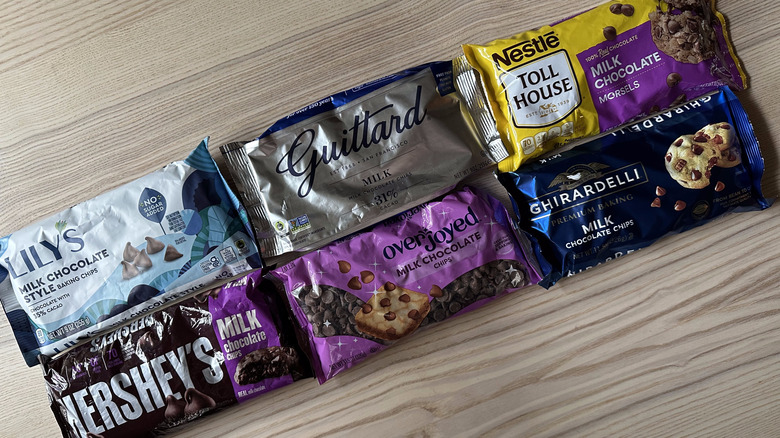 Bags of milk chocolate baking chips on wooden table