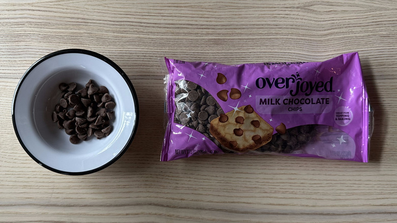 Overjoyed Milk Chocolate Chips on wooden table