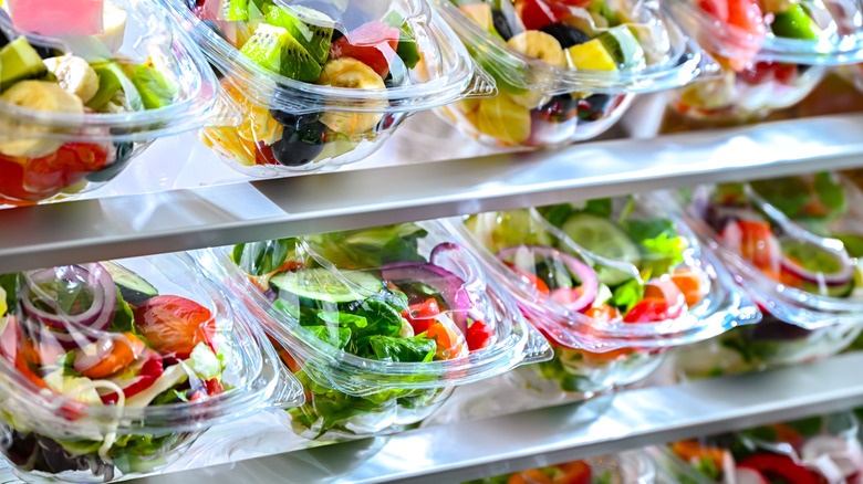 Plastic containers filled with healthy prepared foods