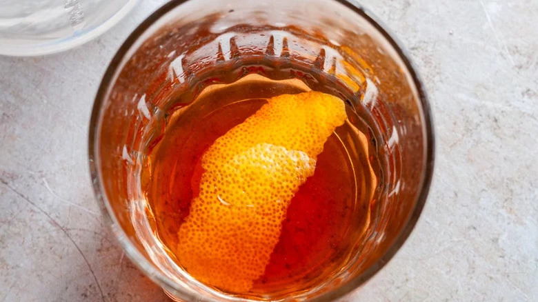 Aerial view of a Sazerac in old fashioned glass with orange peel