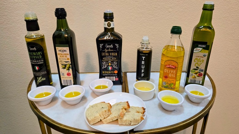 Olive oils sold at Aldi with tasting cups and bread
