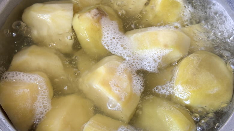 Potato boiling in a pot