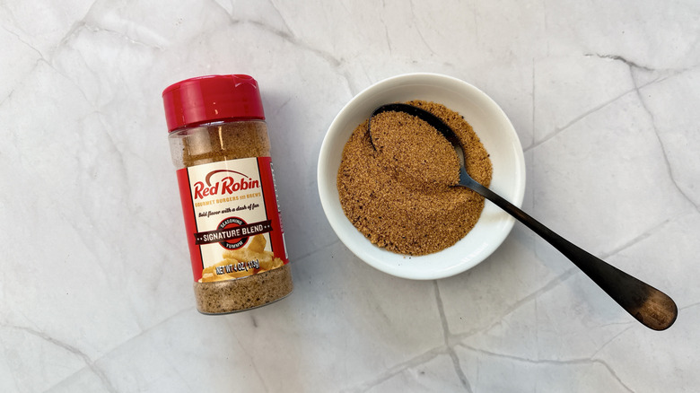Seasoning container with bowl and a spoon
