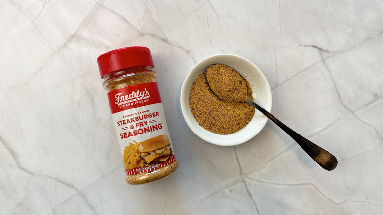Seasoning container with bowl and a spoon