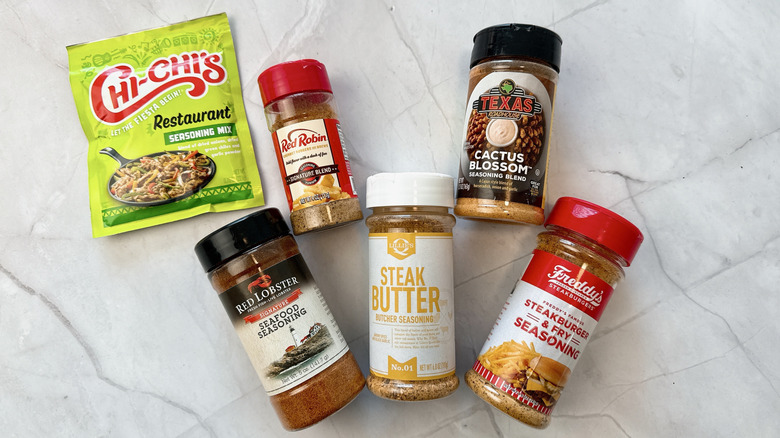 6 different spice blends, 5 bottles and a packet