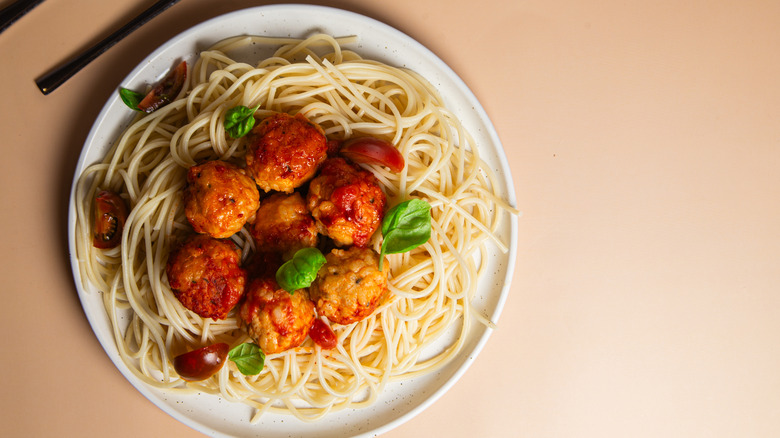 Plate with a traditional offering of spaghetti noodles and meatballs