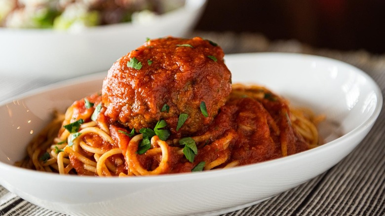 Large meatball on top of spaghetti noodles from Maggiano's