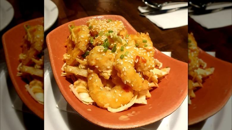 Small red bowl of spicy shrimp