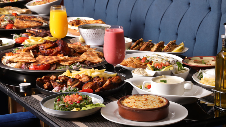 Restaurant table full of assorted dishes