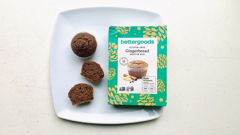 Box of Bettergoods Gluten Free Gingerbread Mix on a plate with baked cupcakes