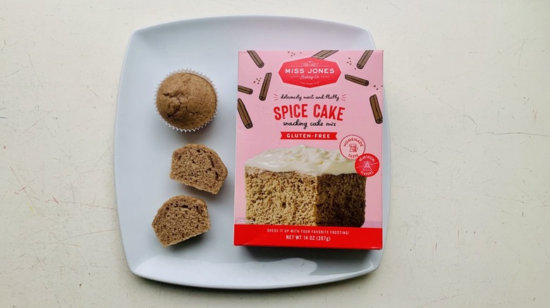 Box of Miss Jones Gluten-Free Spice Cake Mix on a plate with baked cupcakes