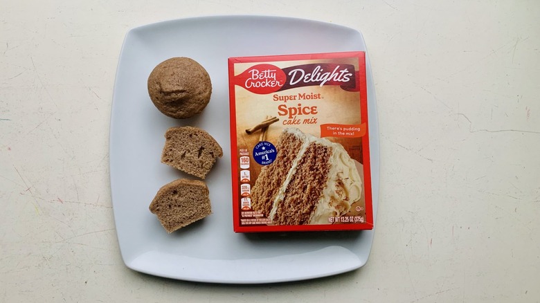 Betty Crocker Delights Spice Cake Mix on a plate with baked cupcakes