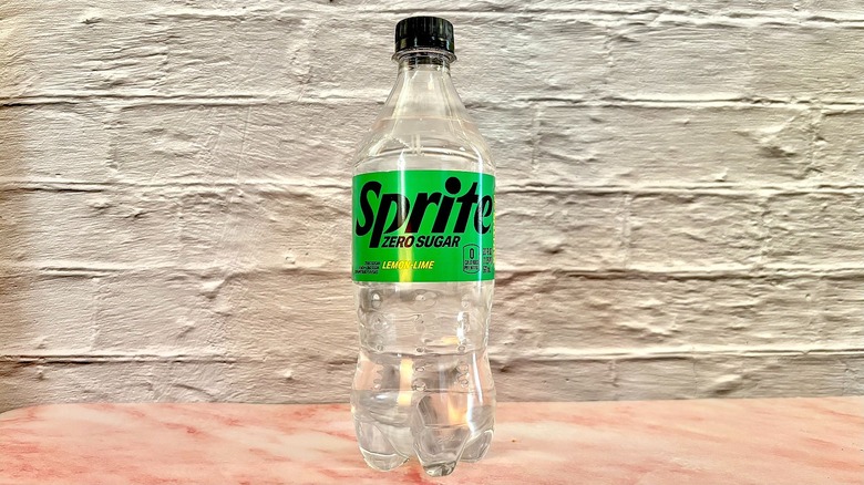 Bottle of Sprite zero sugar on pink marble surface