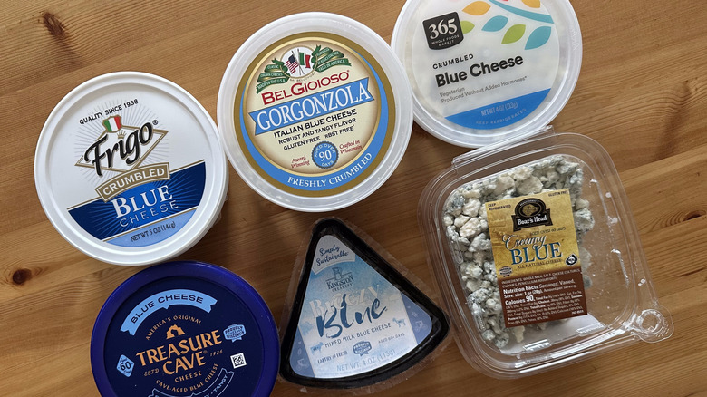 Blue cheeses on wooden table