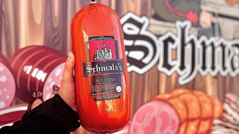 Person holding up a package of Schmalz's Bologna German Brand