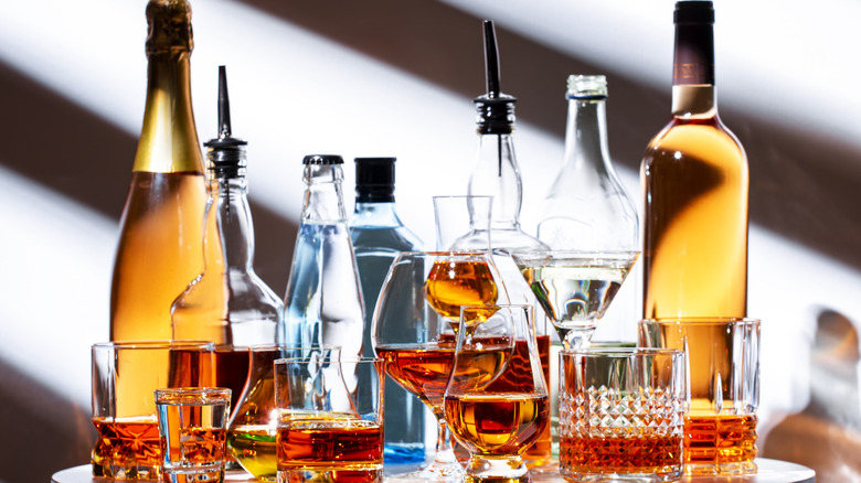 Table of various tequila bottles and glasses