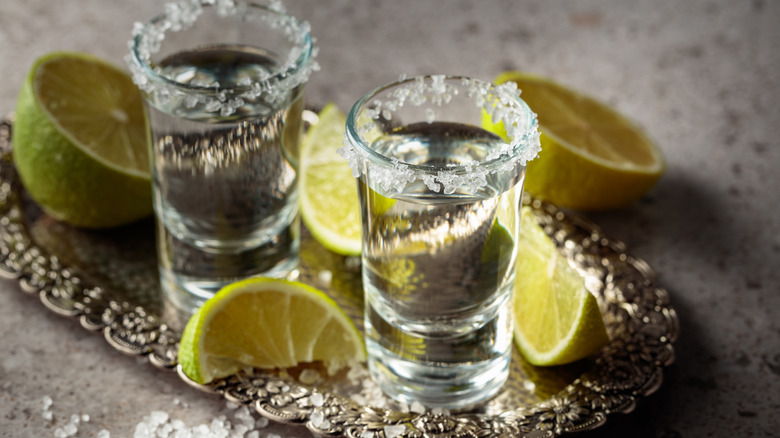 Two tequila shots with salt and lime