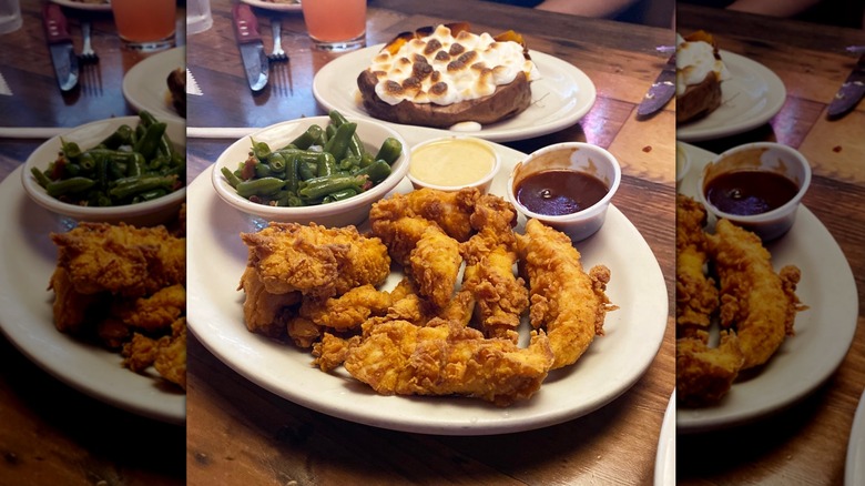 Texas Roadhouse chicken critters with side of green beans on white plate