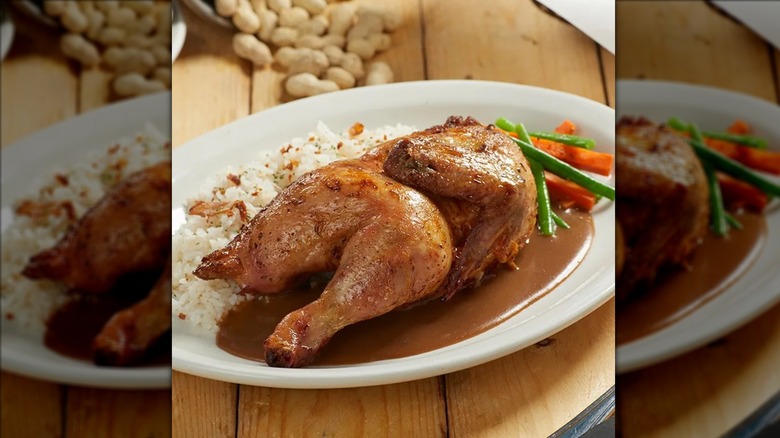 Texas Roadhouse oven-roasted half chicken on white plate