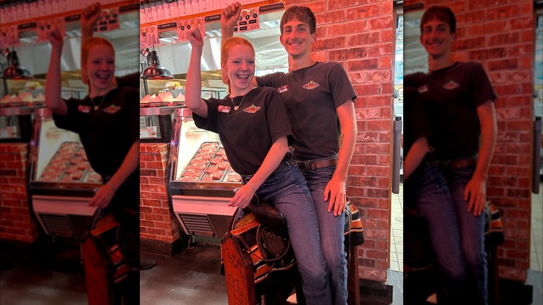 Two Texas Roadhouse servers sitting on the birthday saddle, mirrored image