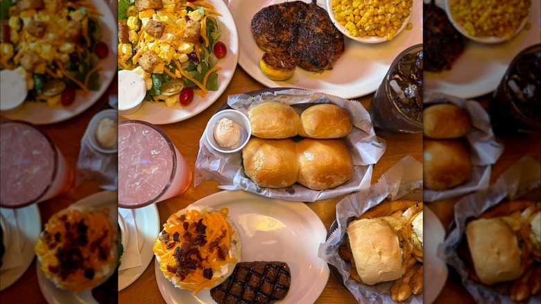 Table full of Texas Roadhouse food, mirrored image