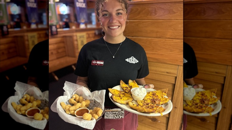 Sever holding two plates of food in Texas Roadhouse uniform, mirrored image