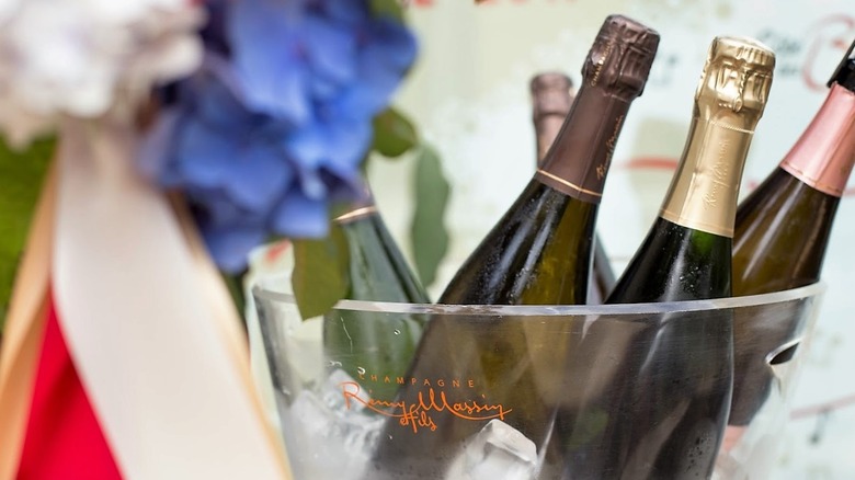 champagne bottles in ice bucket