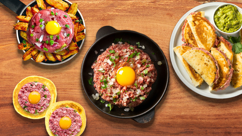 Steak tartare on fries, tacos, and blinis 